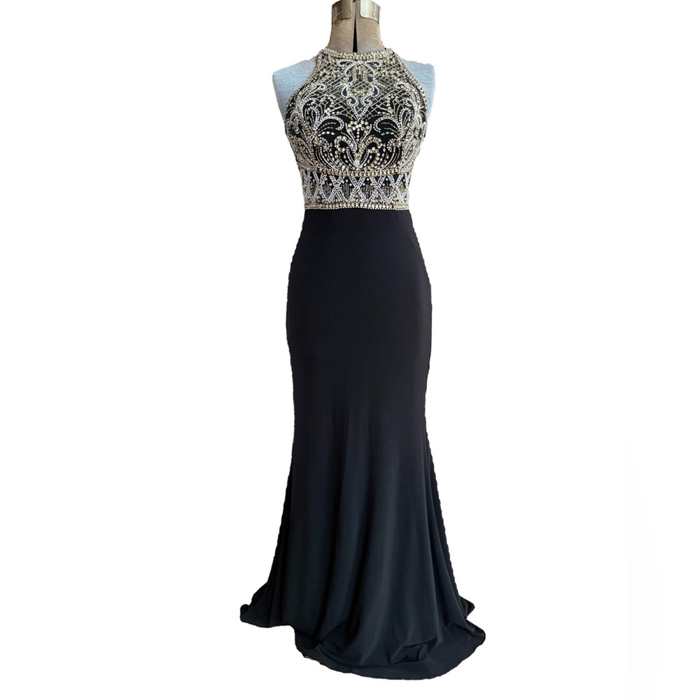 Clarisse fitted evening dress with halter neckline heavily beaded small train.
